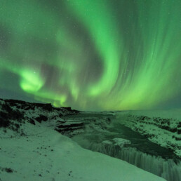 waterfall snow northern lights