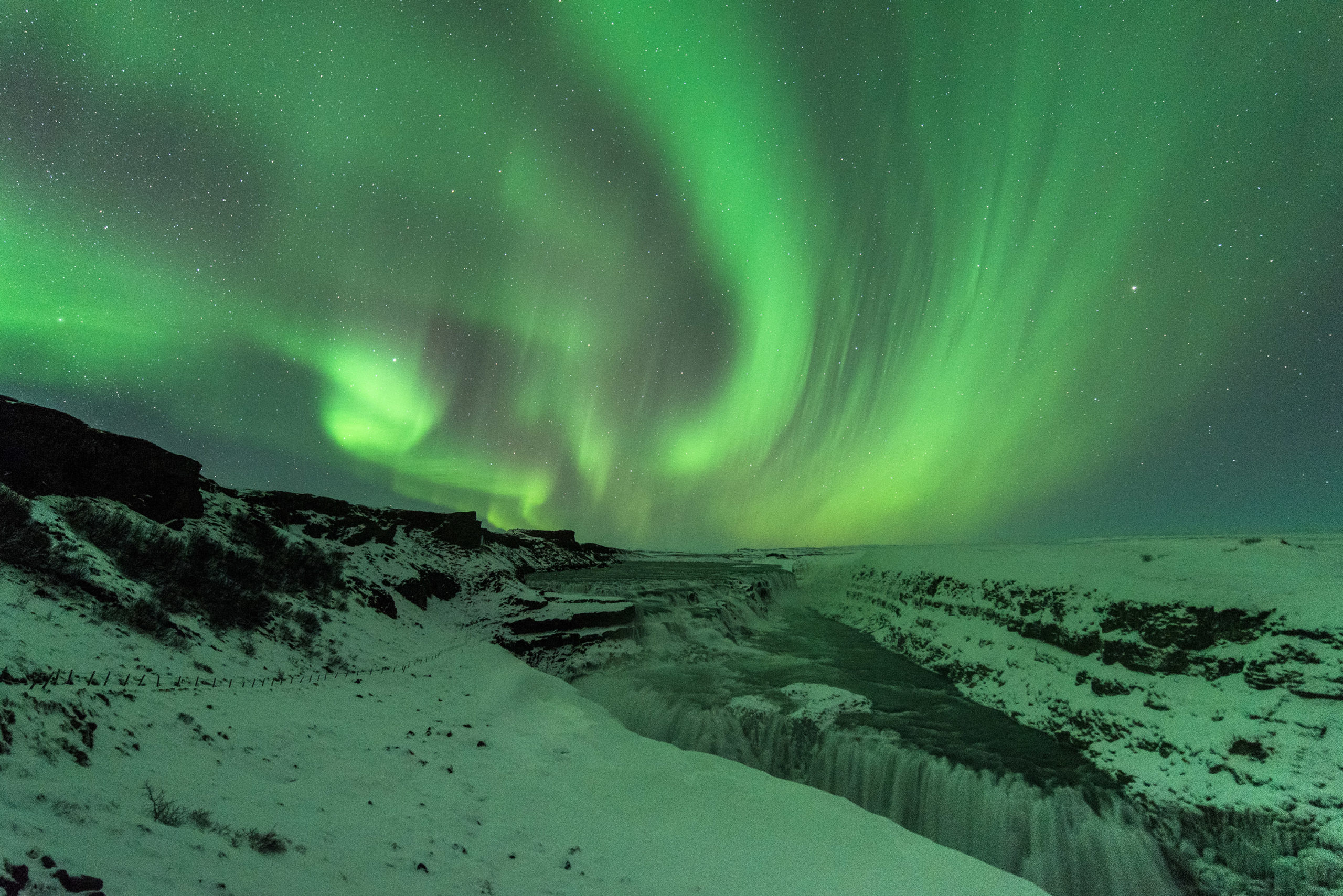 waterfall snow northern lights