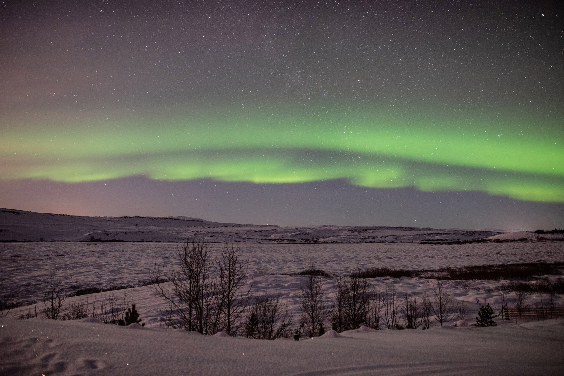 weak aurora in iceland snowy landscape