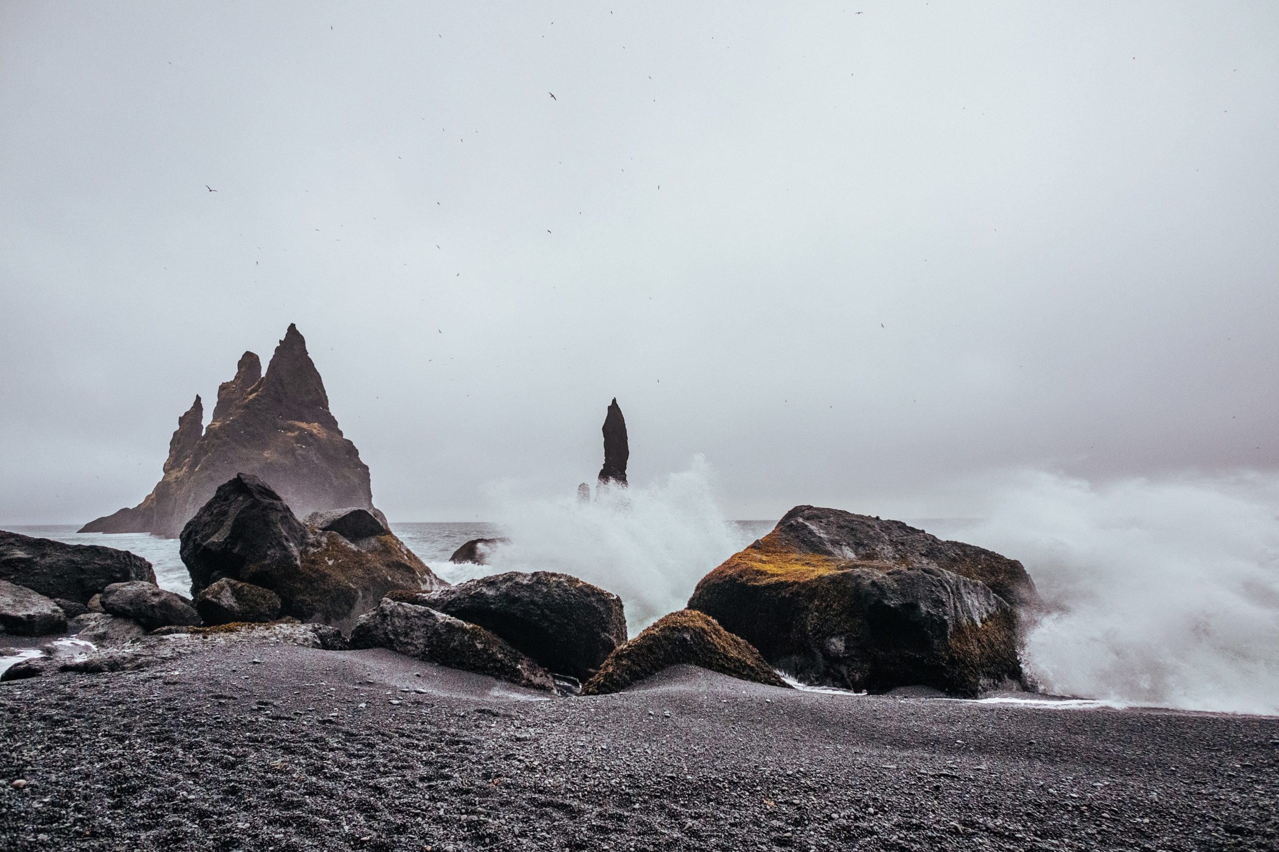Waves crash over Reynisfjara beach in Iceland