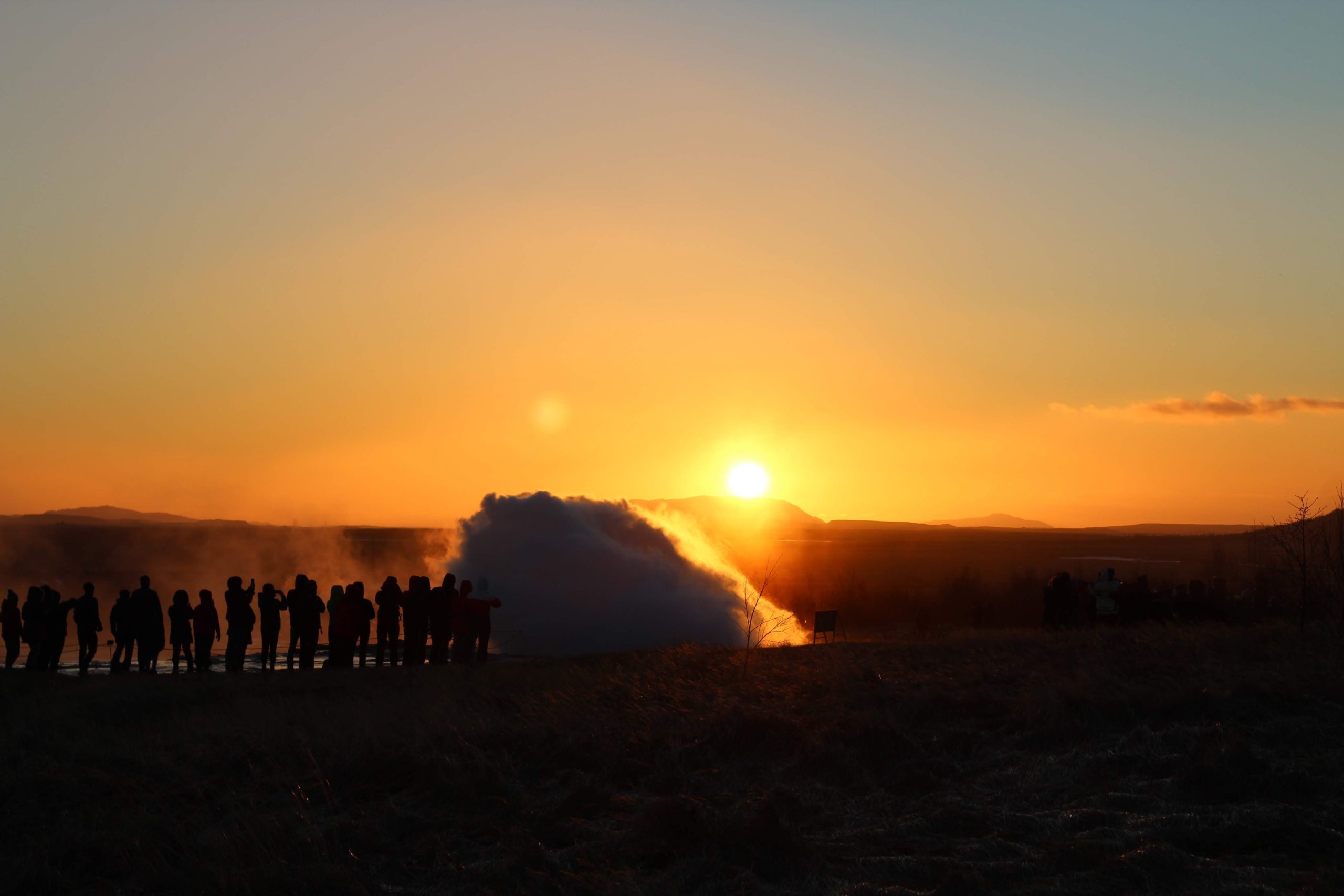 Strokkur erupts during sunset in Iceland