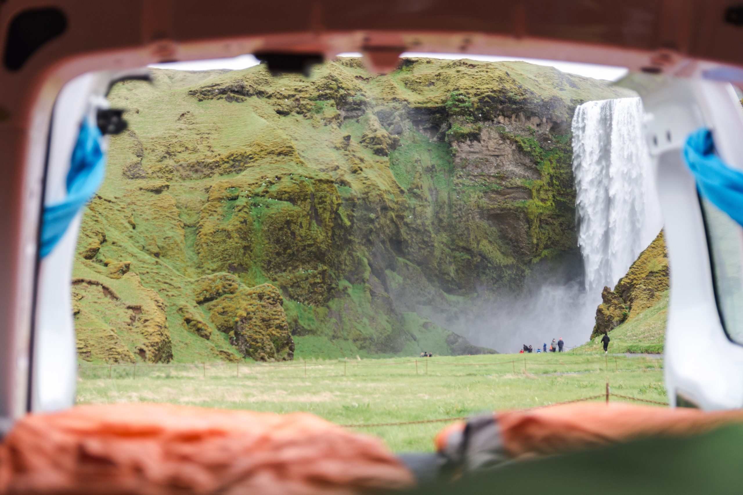 Looking out a tent at Skógafoss, Iceland