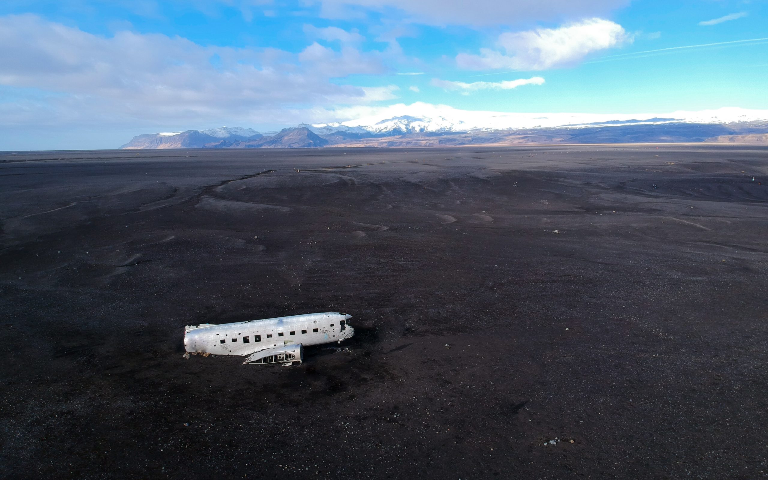 The plane wreck in Iceland is surrounded by black sand desert