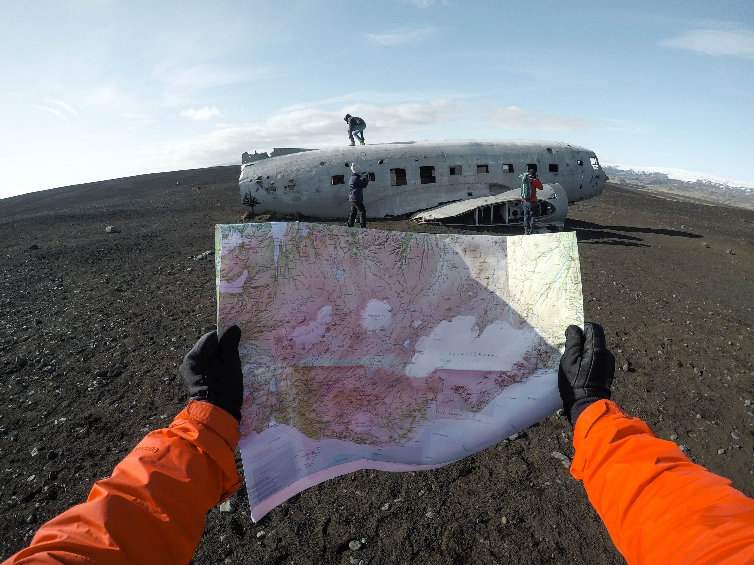 Holding a map in front of Iceland's DC plane wreck