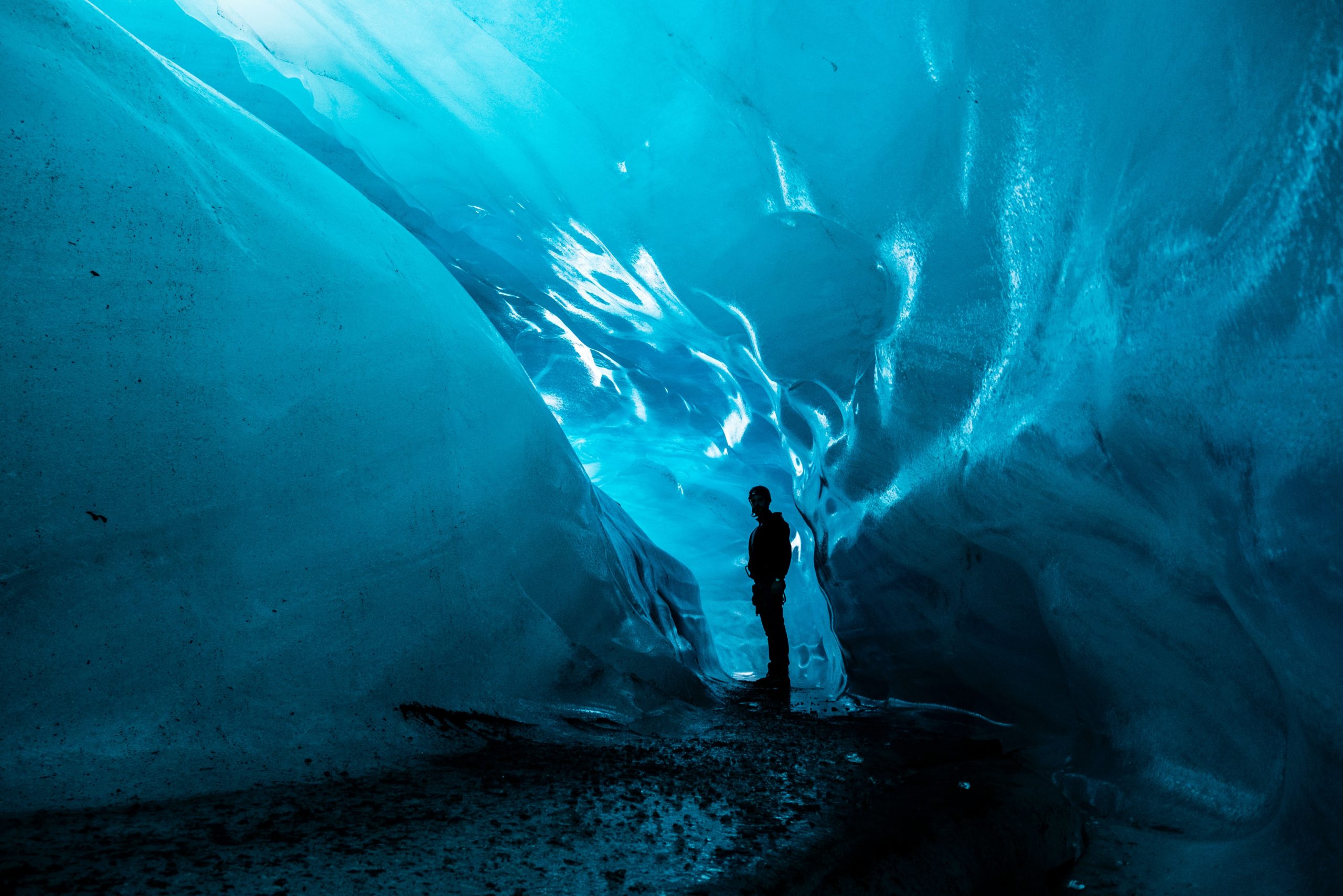 A man inside an ice cave in Iceland