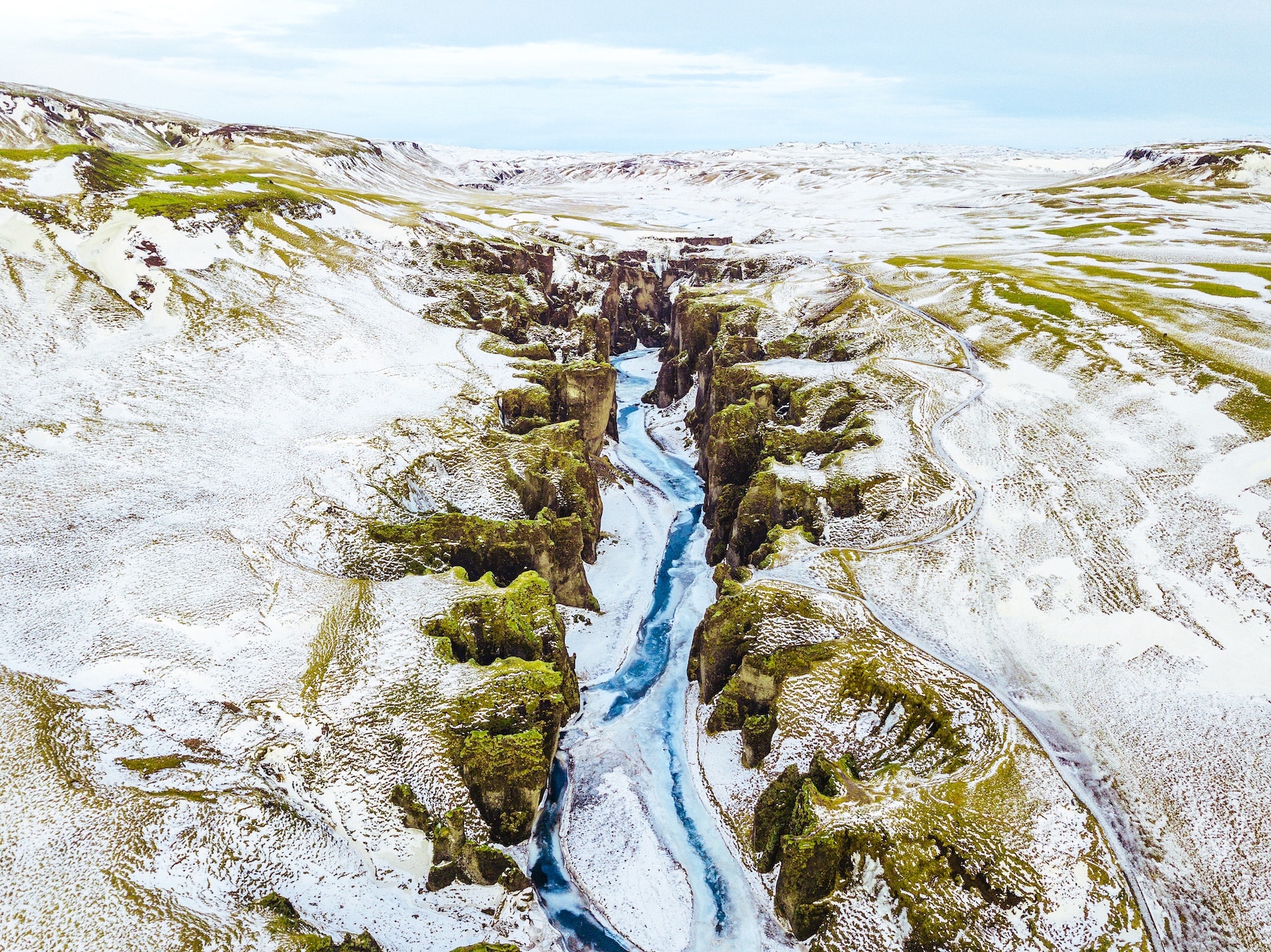frozen river in Fjaðrárgljúfur